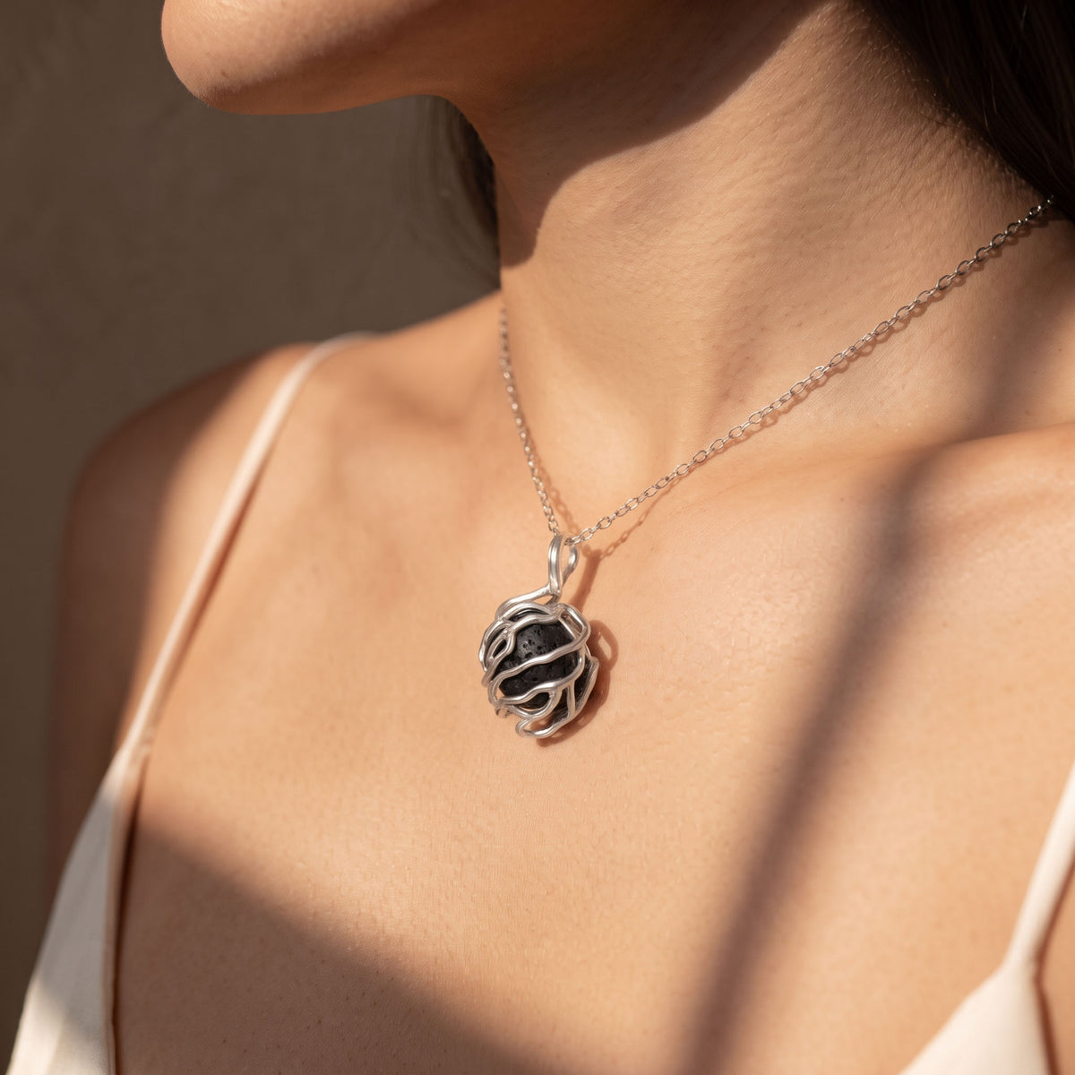 Volcanic Lava Stone Sphere Pendant | Sculpted Silver Cage Necklace